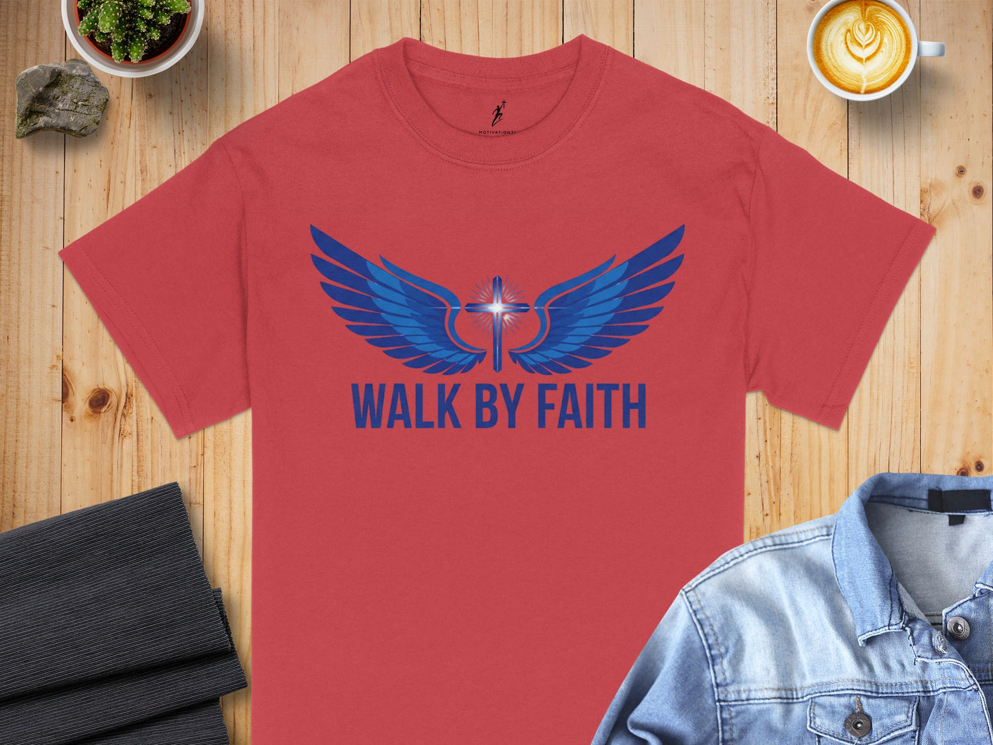 Red t-shirt with blue winged cross and "WALK BY FAITH" text.