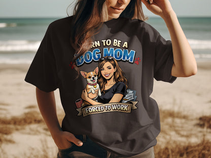 Illustration of woman holding dog with text "BORN TO BE A DOG MOM FORCED TO WORK"