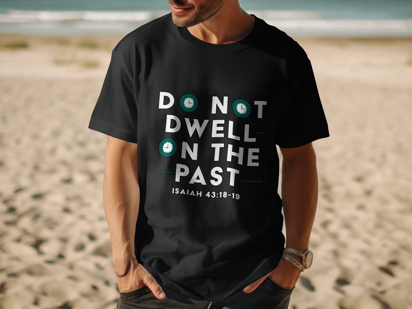 Black t-shirt with white text "Do Not Dwell On The Past" and inscription Isaiah 43:18-19.