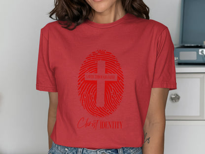 Red t-shirt with a red fingerprint graphic containing a cross and text.