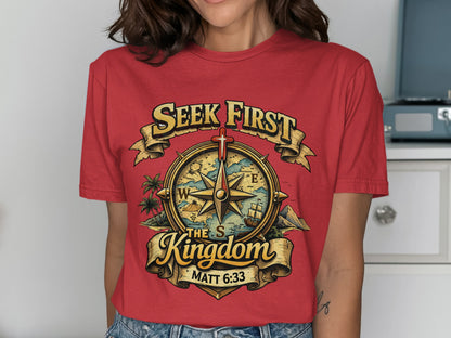 Red t-shirt with graphic of a compass and text: Seek First The Kingdom, Matt 6:33