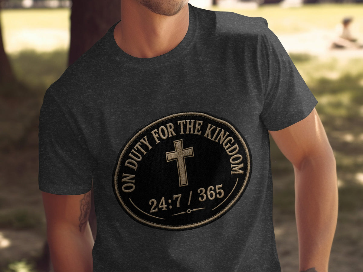 Dark grey t-shirt with oval patch featuring a cross and text "ON DUTY FOR THE KINGDOM 24:7 / 365".