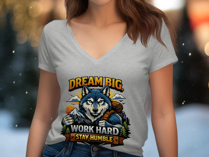 Graphic tee with wolf, mountains, and text saying "DREAM BIG. WORK HARD. STAY HUMBLE."