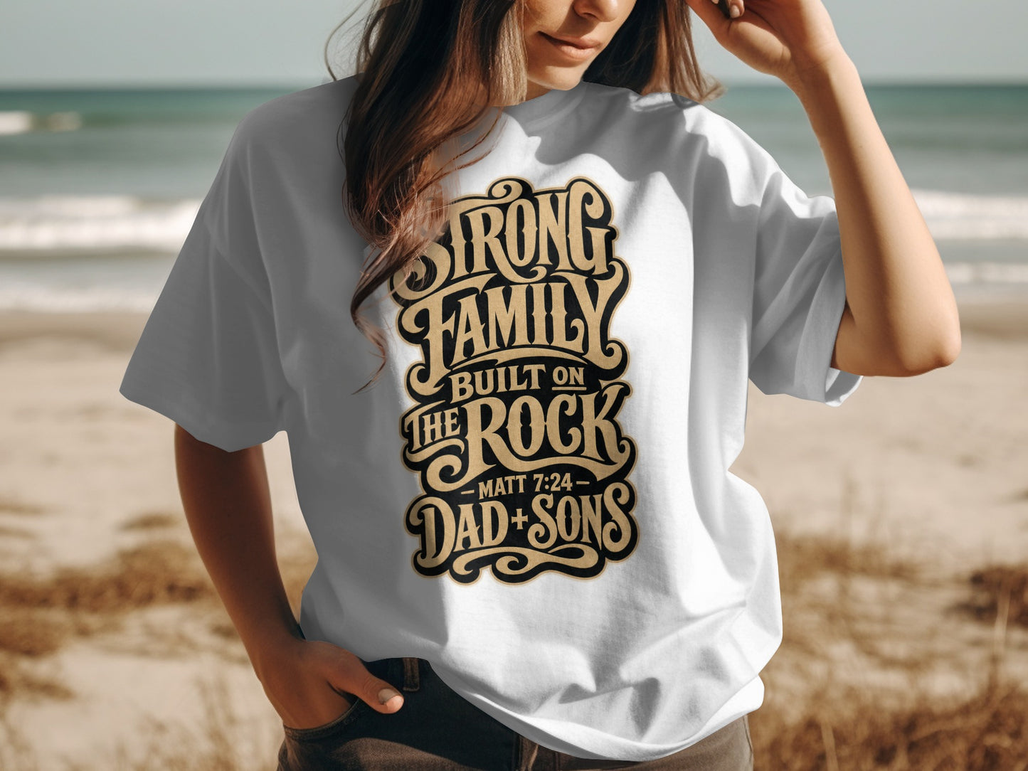 White t-shirt with "Strong Family Built on the Rock" and "Dad + Sons" text.