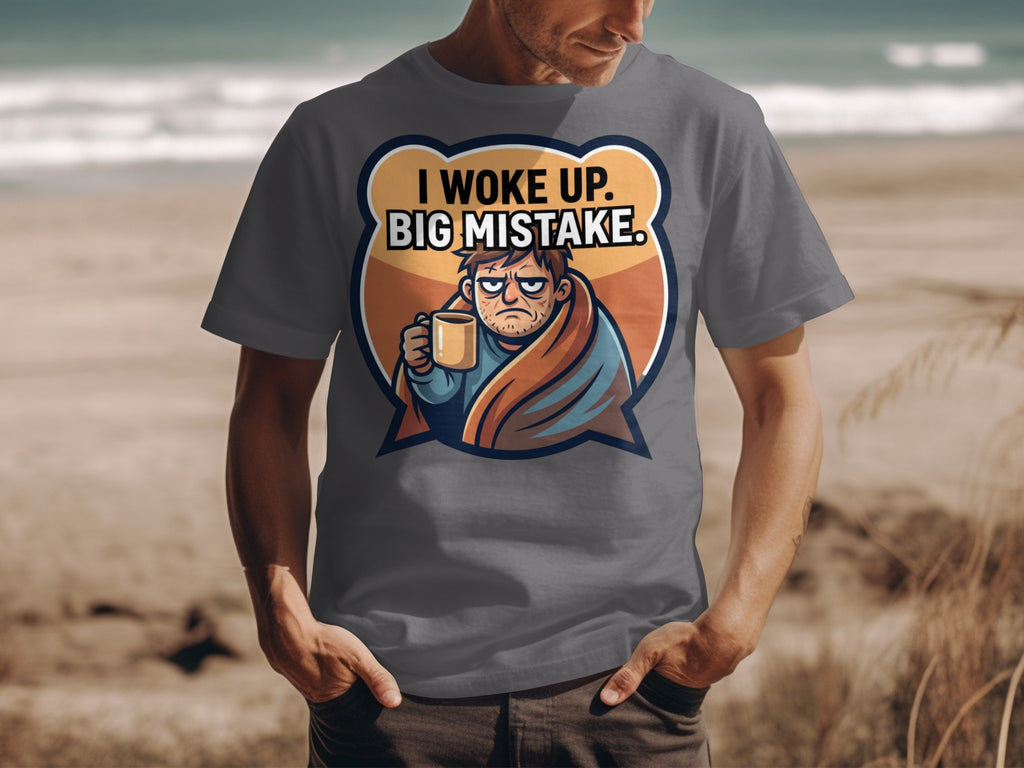 Grey t-shirt with graphic that reads "I WOKE UP. BIG MISTAKE."