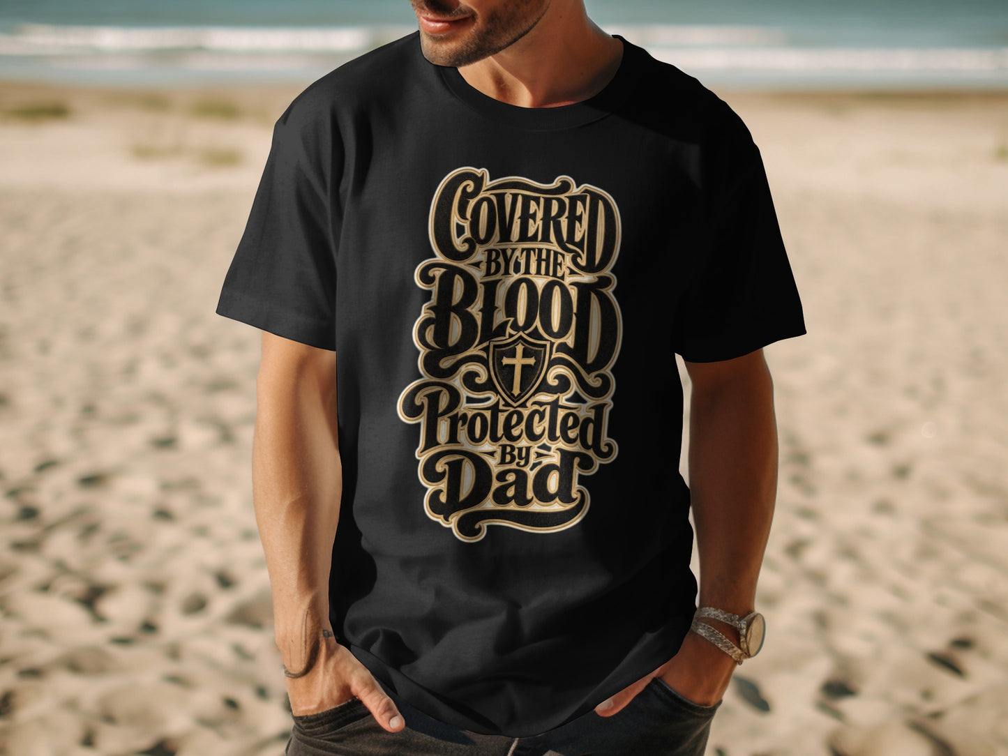 Black t-shirt with text "Covered by the Blood Protected by Dad".