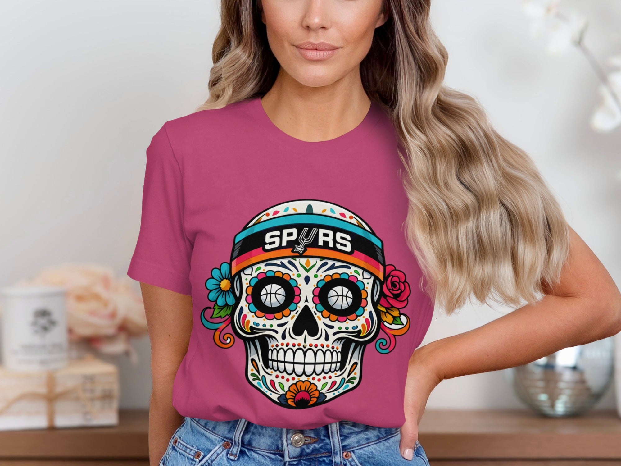 Pink t-shirt with a sugar skull graphic featuring Spurs logo and basketball eyes.