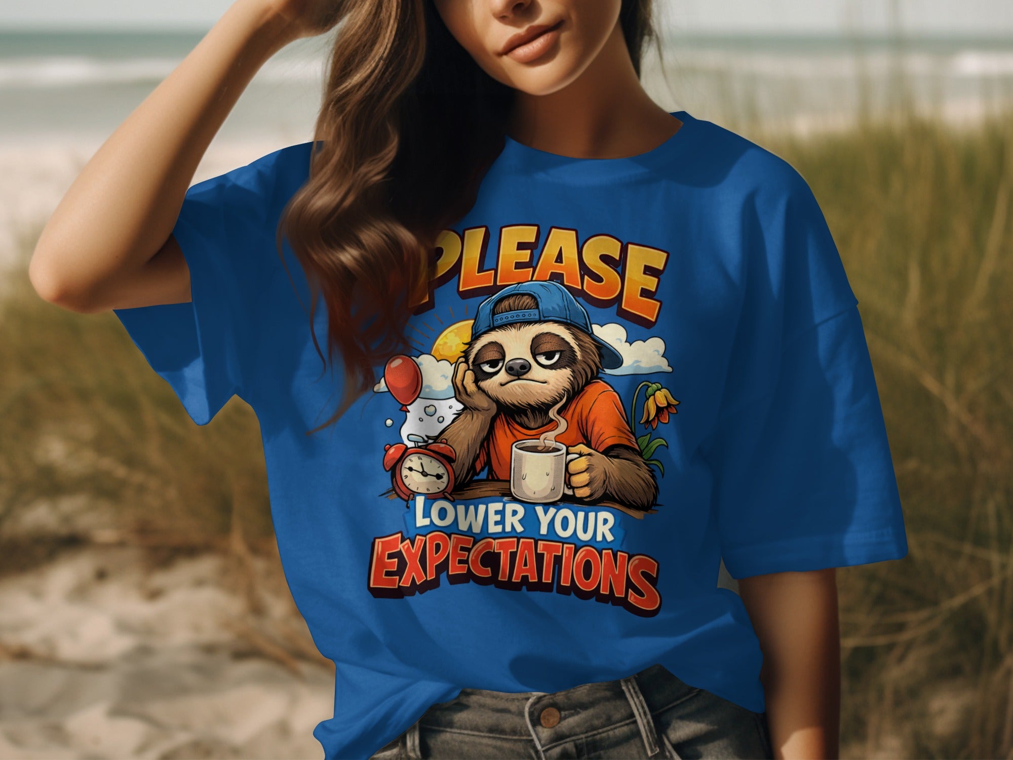 Blue t-shirt with a sloth graphic and text "PLEASE LOWER YOUR EXPECTATIONS".