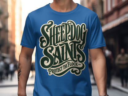 Blue t-shirt with "SHEEPDOG SAINTS PROTECT THE FLOCK" graphic text.