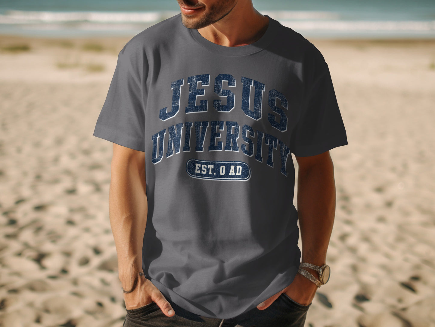 Gray t-shirt with "JESUS UNIVERSITY EST. 0 AD" text on chest