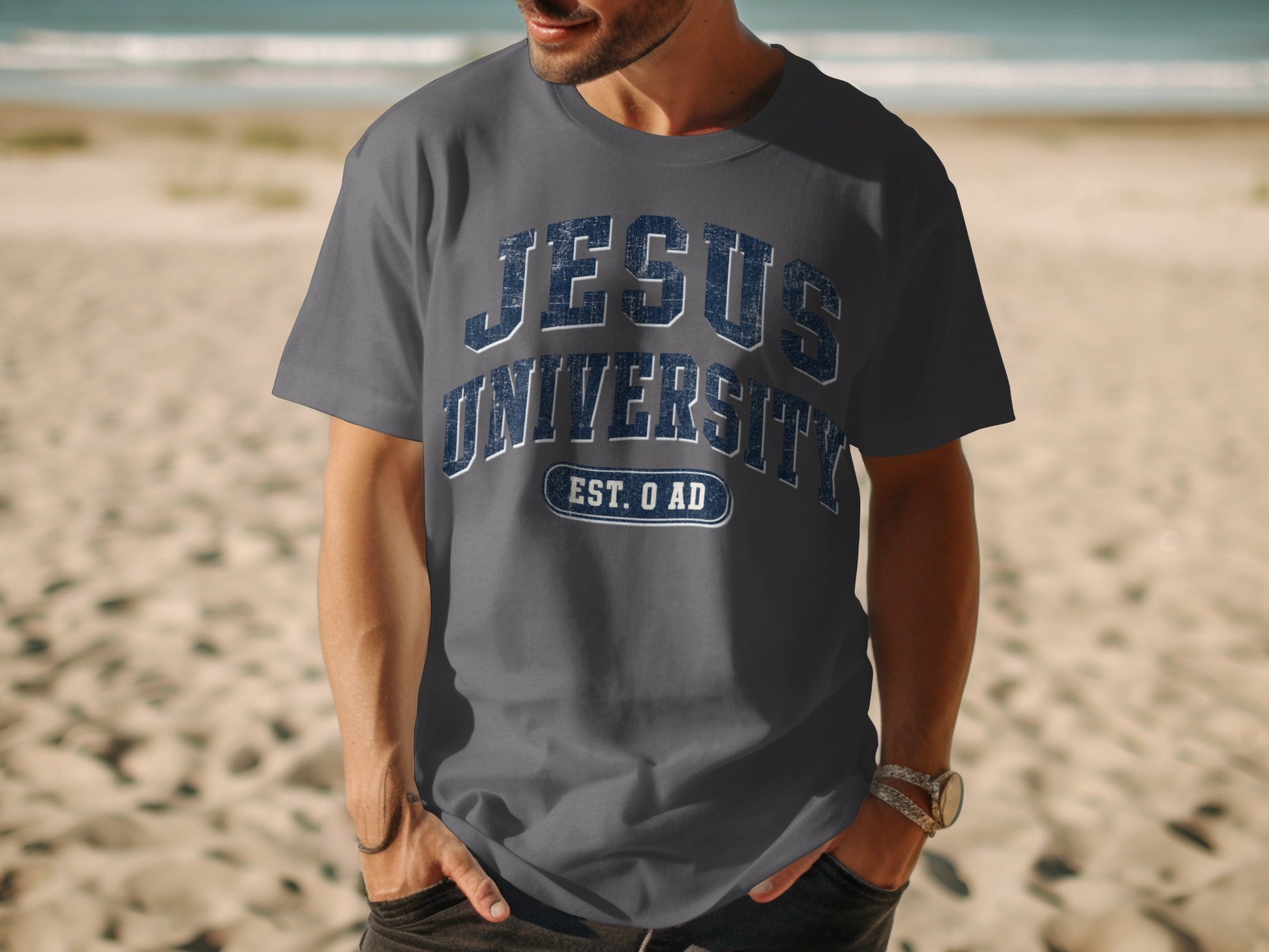 Gray t-shirt with "JESUS UNIVERSITY EST. 0 AD" text on chest