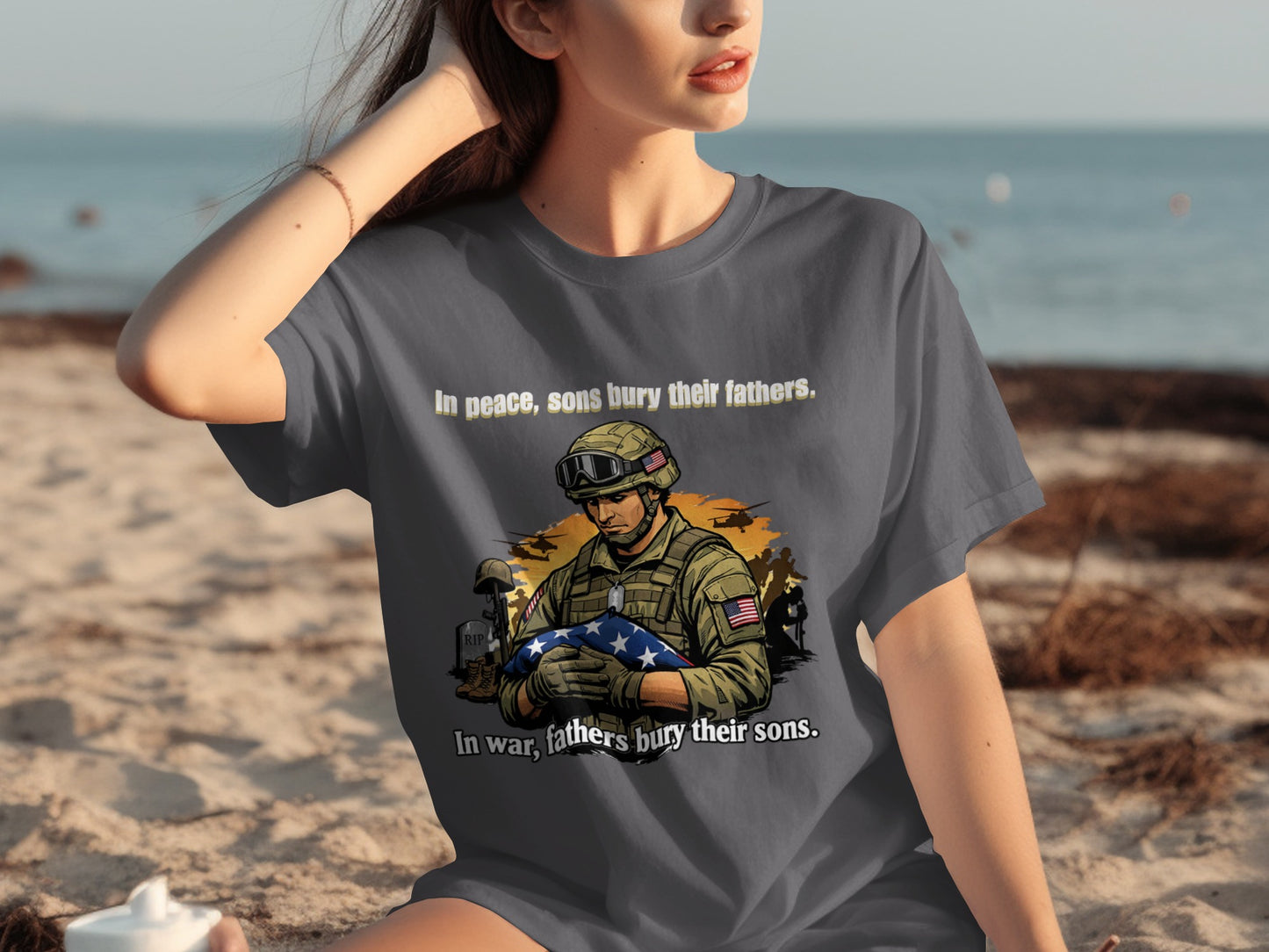 Gray t-shirt with a soldier holding a US flag graphic and text.