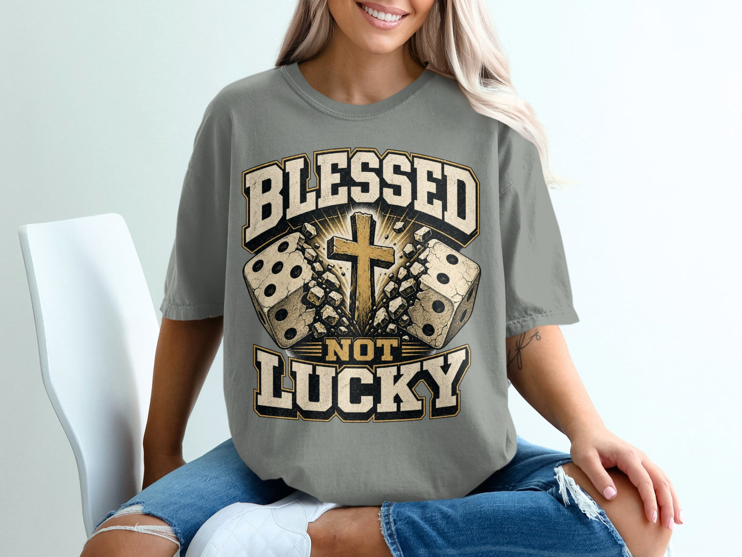 Grey t-shirt with "Blessed Not Lucky" text, dice, and cross graphic.