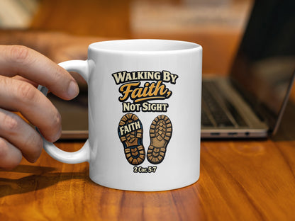 White mug with "Walking by Faith, Not Sight" and boot prints.