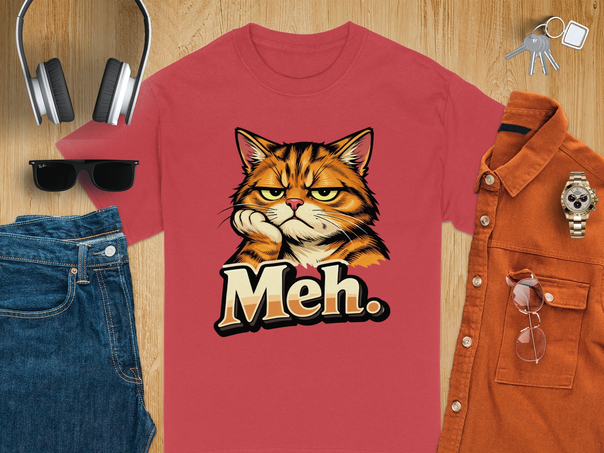 Red t-shirt with a cartoon cat and the word "Meh."