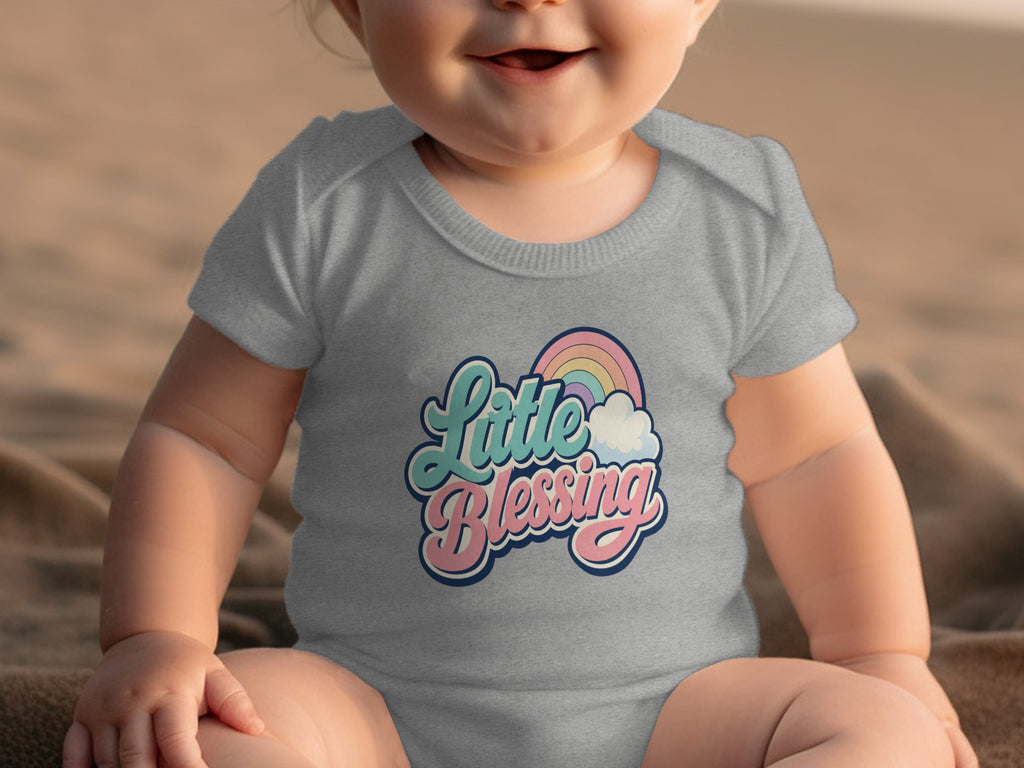 Grey baby onesie with "Little Blessing" text and rainbow graphic.