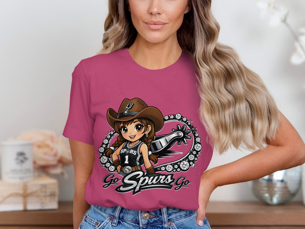 Pink t-shirt with cartoon girl wearing cowboy hat and Spurs jersey, saying "Go Spurs Go".