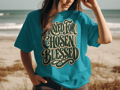 Teal t-shirt with "Prayed for, Chosen, Blessed" text design.
