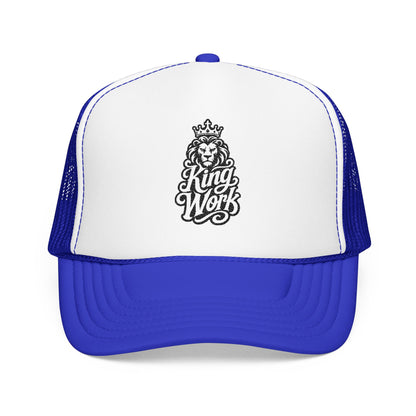 Royal blue and white trucker hat with black lion and crown graphic.