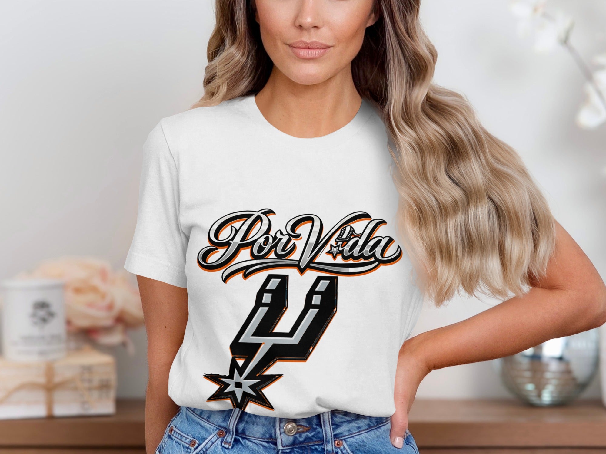 White t-shirt with "Por Vida" and Spurs logo graphic.
