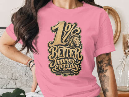 Pink t-shirt with "1% BETTER Improve every day" text and lion graphic.