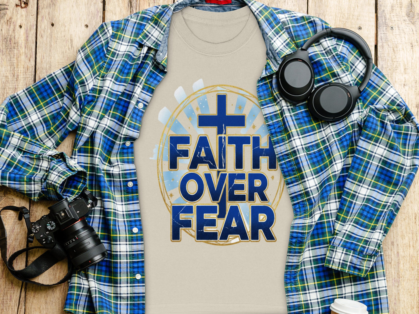 Beige t-shirt with blue text "FAITH OVER FEAR" and a cross graphic.