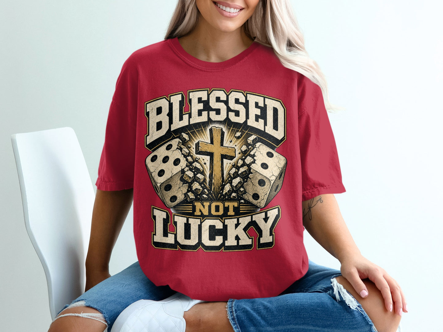 Red t-shirt with "Blessed Not Lucky" text, cross, and dice graphic.