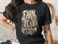 Black t-shirt with "EARN IT" text and lion graphic, "Success isn't given. (It's earned.)"
