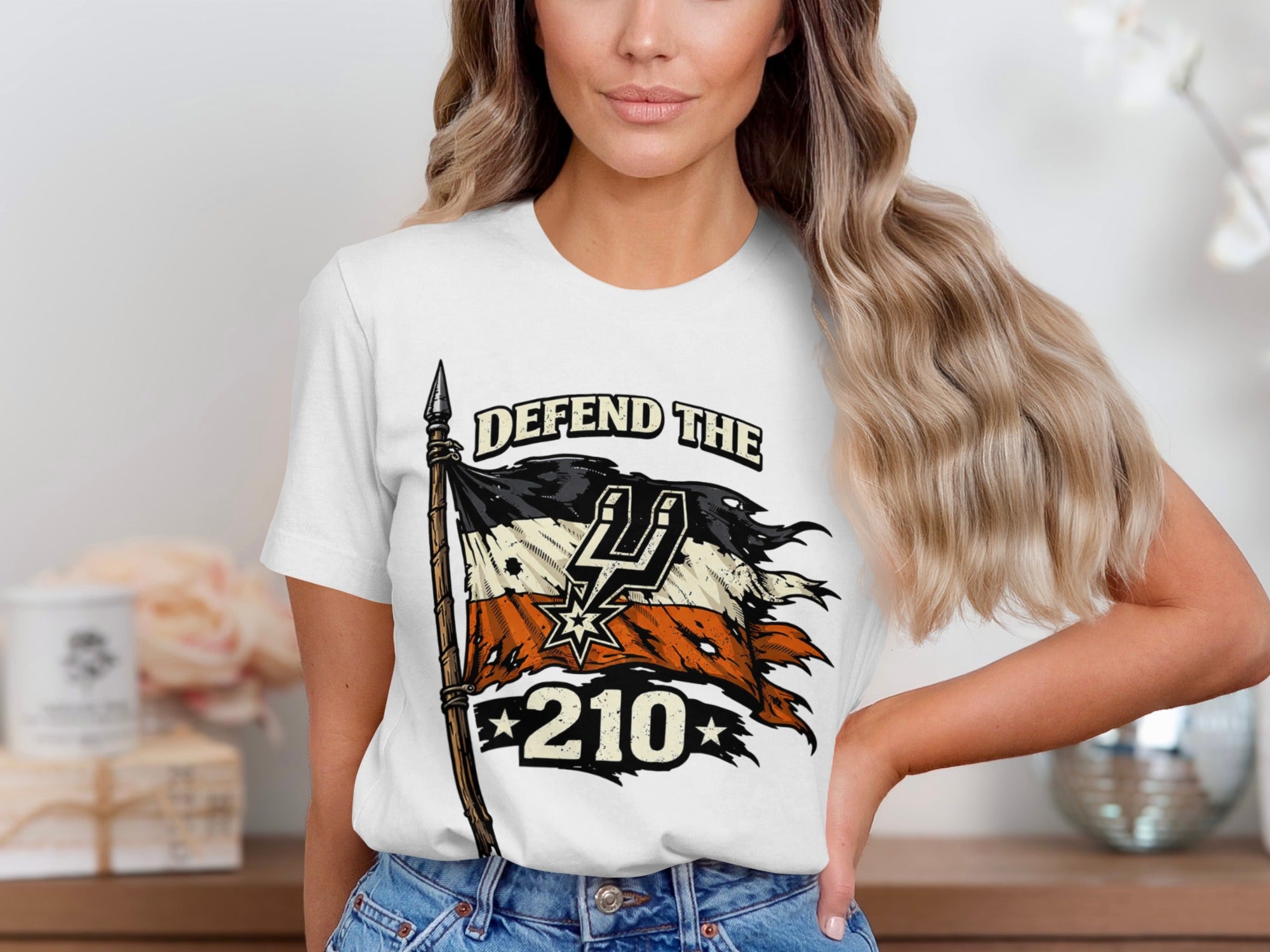 T-shirt with "Defend The 210" text over a tattered flag with spurs logo.