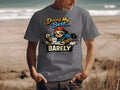 T-shirt graphic: sloth with UGH mug, alarm, laptop, reading "Doing My Best... BARELY".