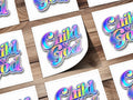 Several stickers with iridescent "Child of God" text on white cards.