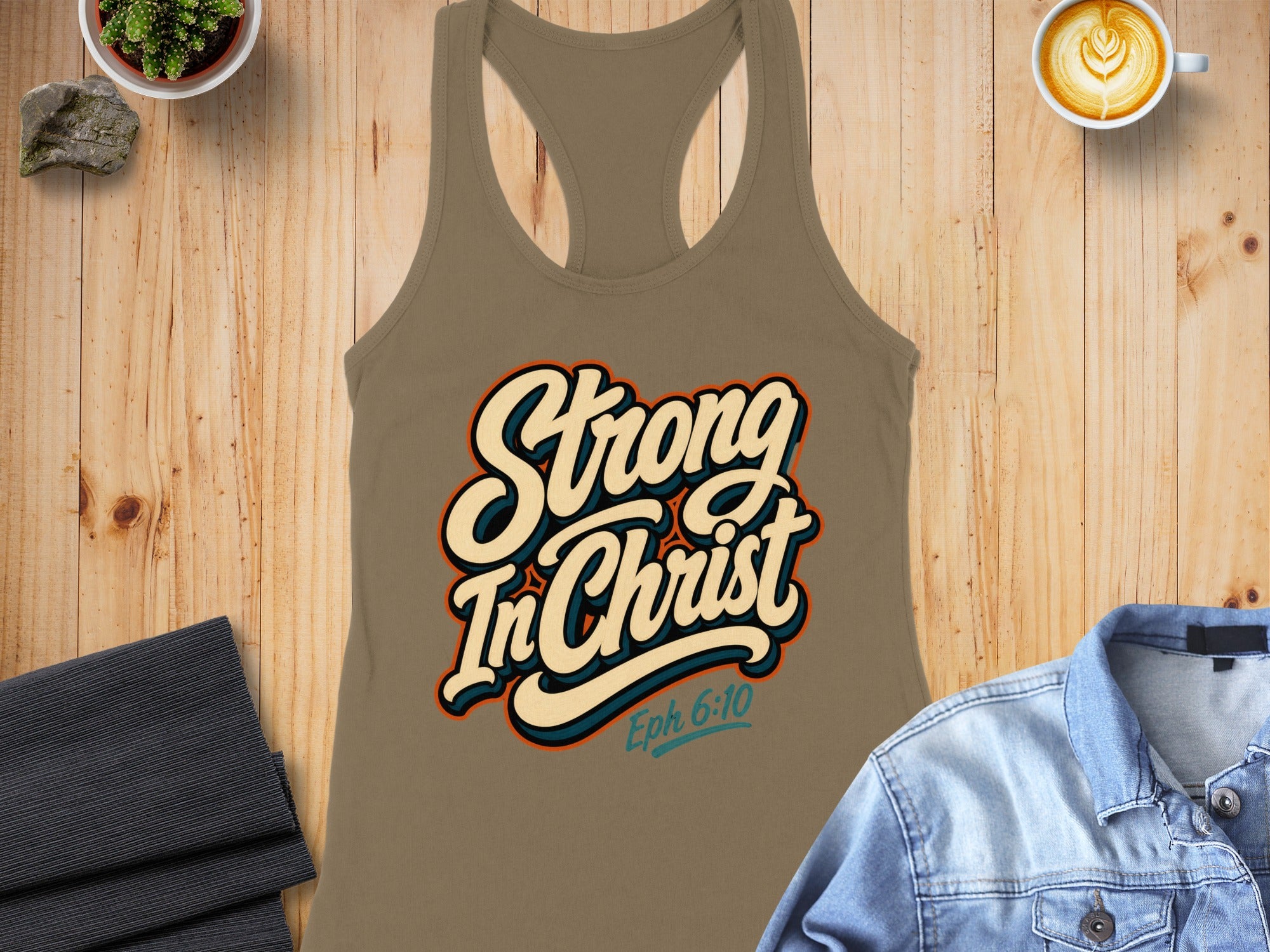 Taupe tank top with "Strong In Christ Eph 6:10" graphic.