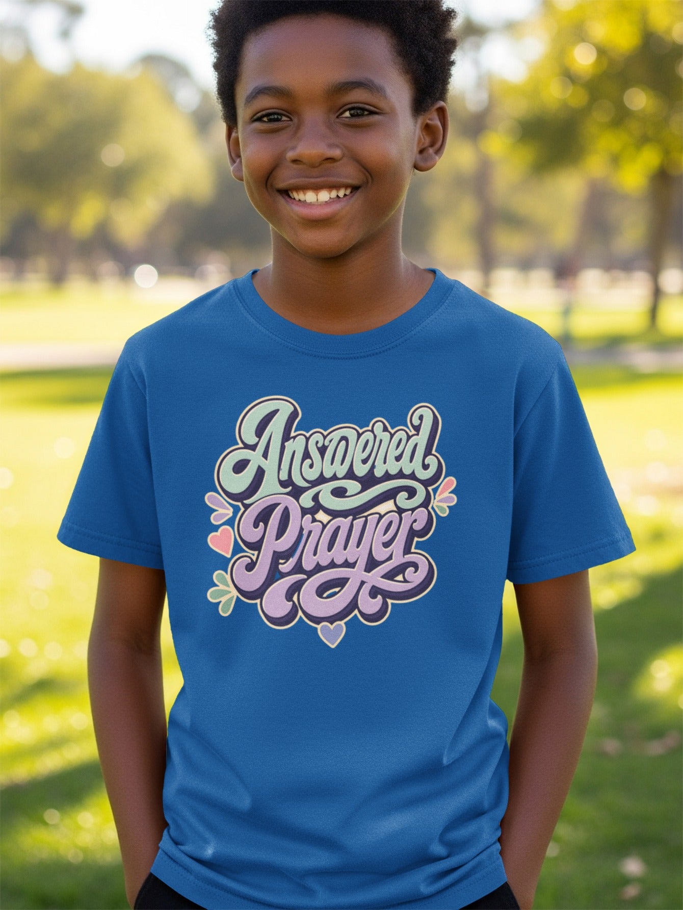 This shirt says "Answered Prayer" with decorative hearts and flowers.