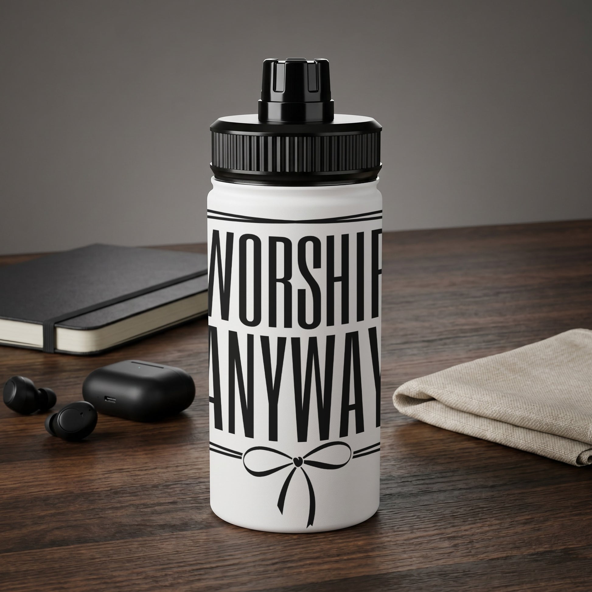 White water bottle with black text "WORSHIP ANYWAY" and a ribbon graphic.
