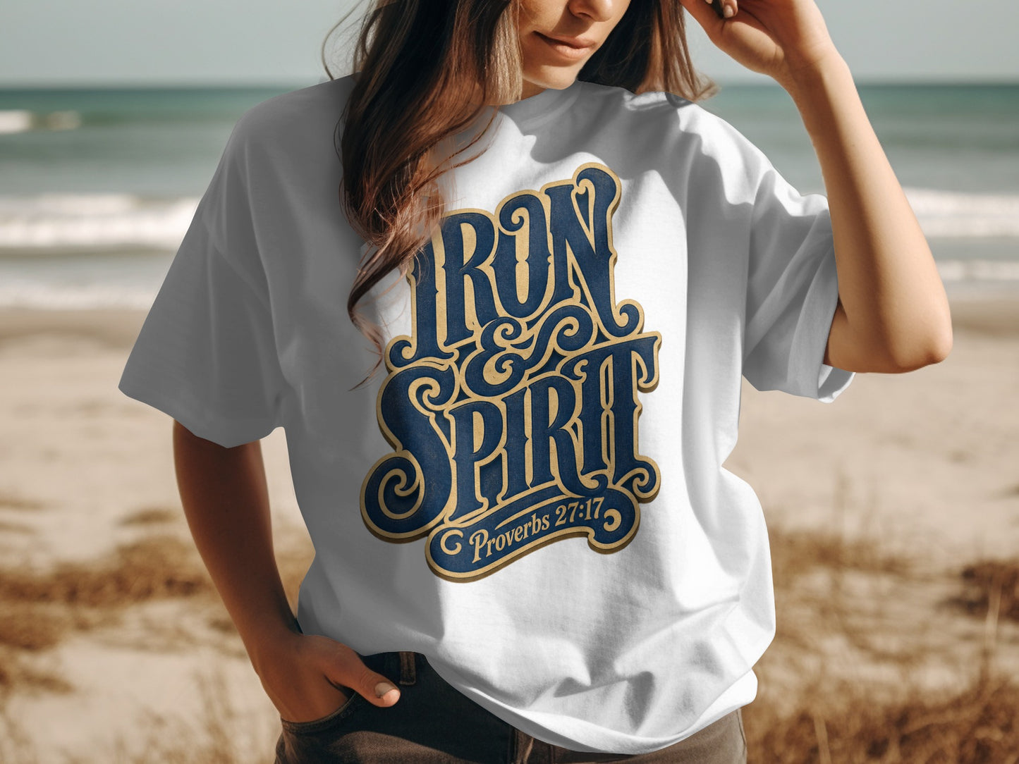 White t-shirt with "Iron Spirit" and "Proverbs 27:17" in blue and gold lettering.