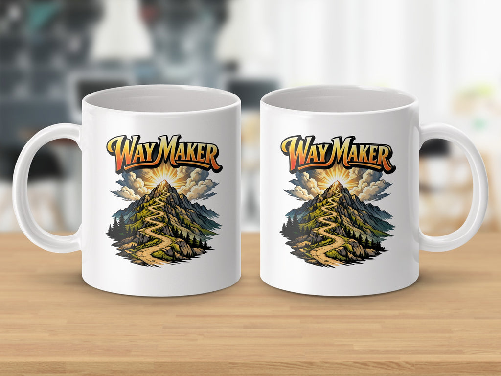 White mugs with "Way Maker" text and mountain pathway artwork.