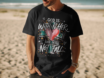 Black t-shirt with "God is Within Her She Will Not Fall" text and a heart on a cross.