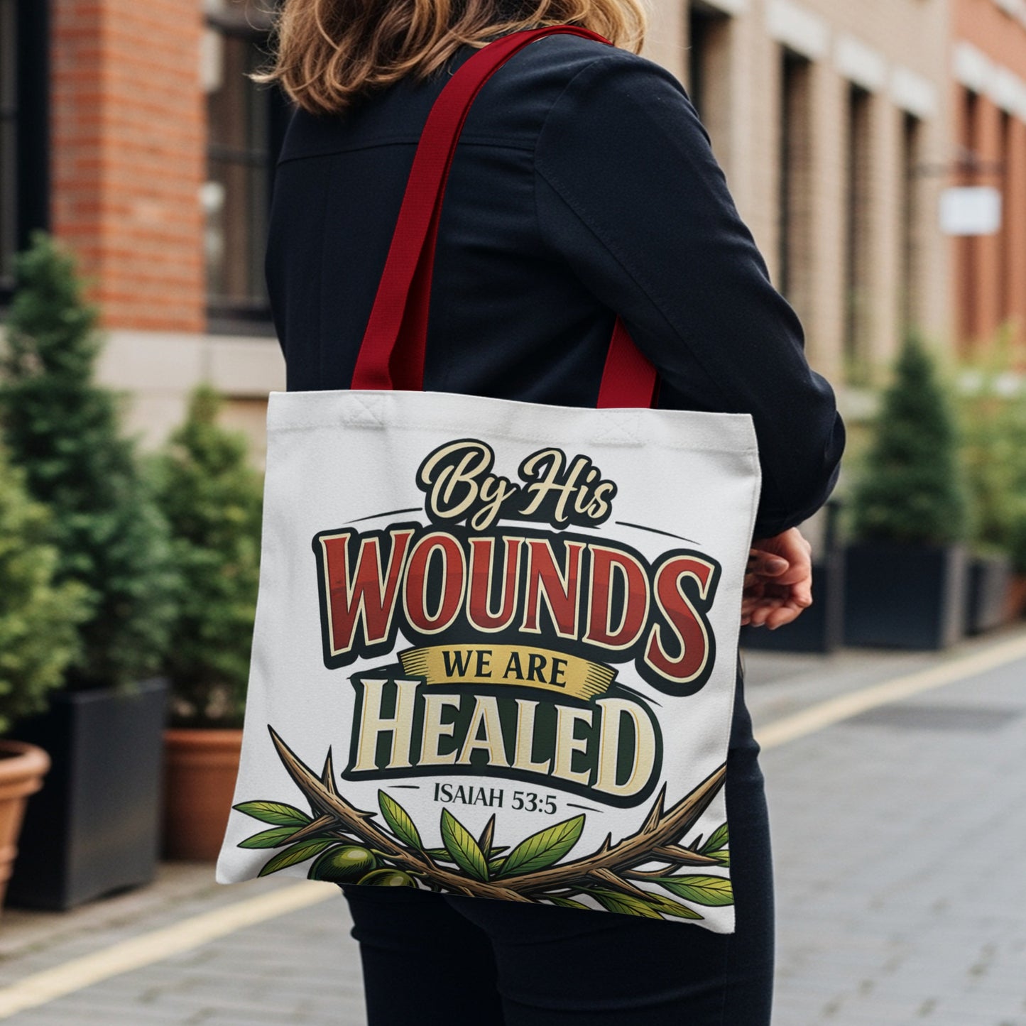 Tote bag with "By His Wounds We Are Healed Isaiah 53:5" text and thorn branch graphic.