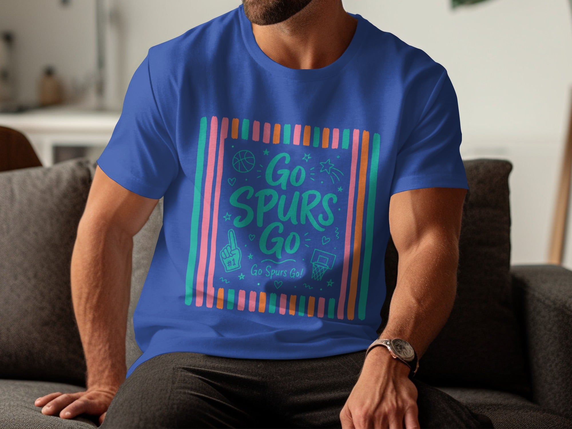 Blue t-shirt with "Go Spurs Go" text, basketball graphics, and colorful stripes.
