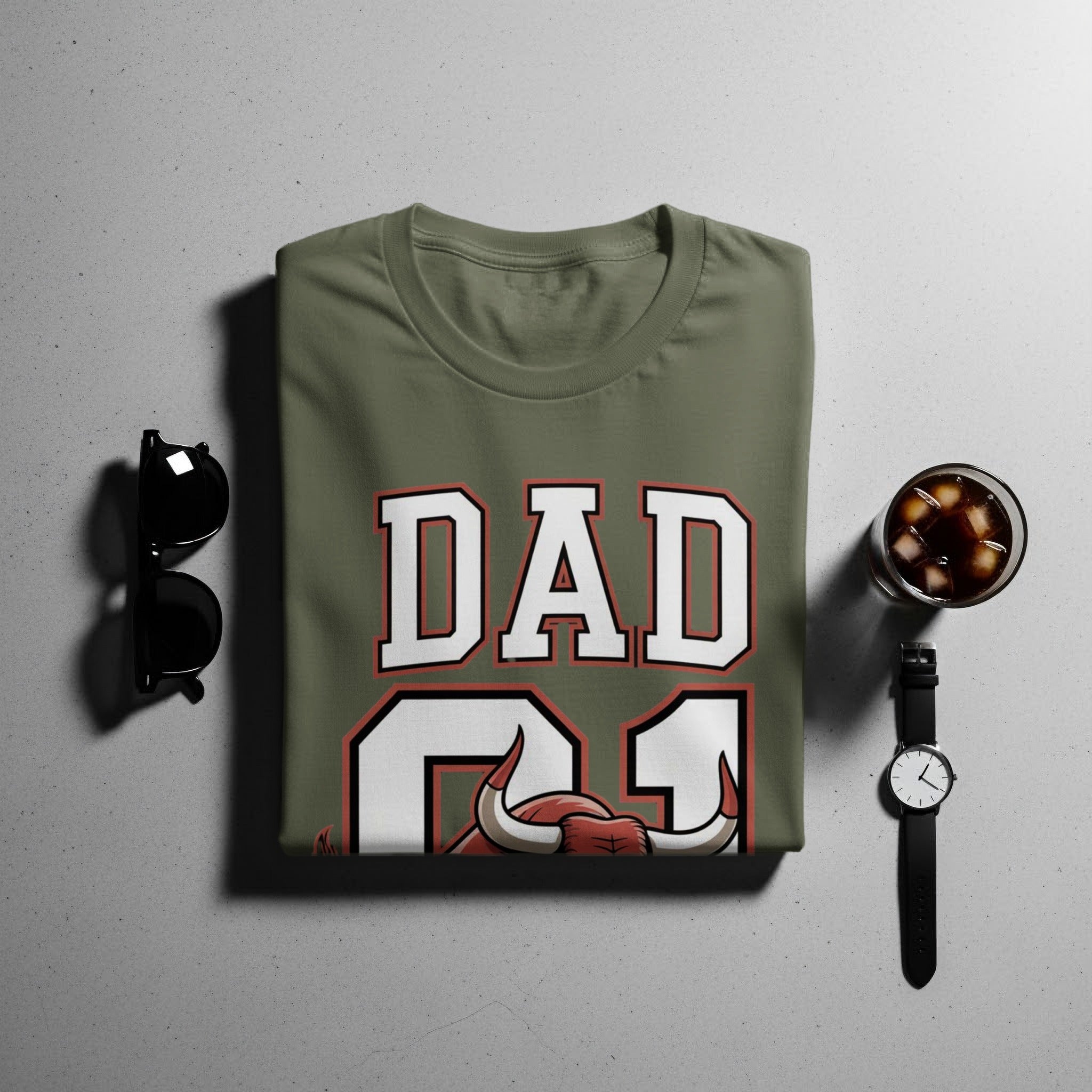 Olive green t-shirt with 'DAD 21' text and bull graphic.