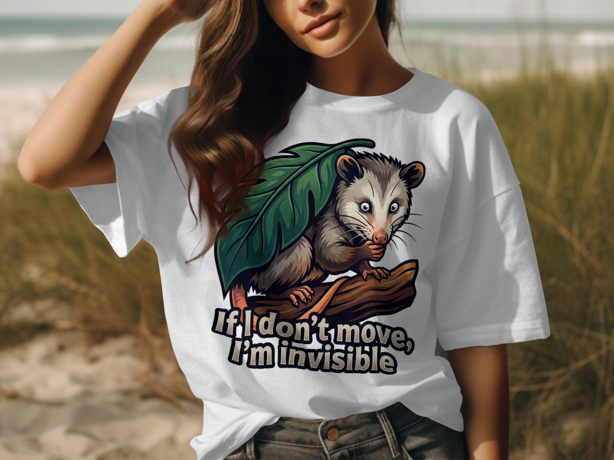 White t-shirt with opossum graphic and text "If I don't move, I'm invisible."