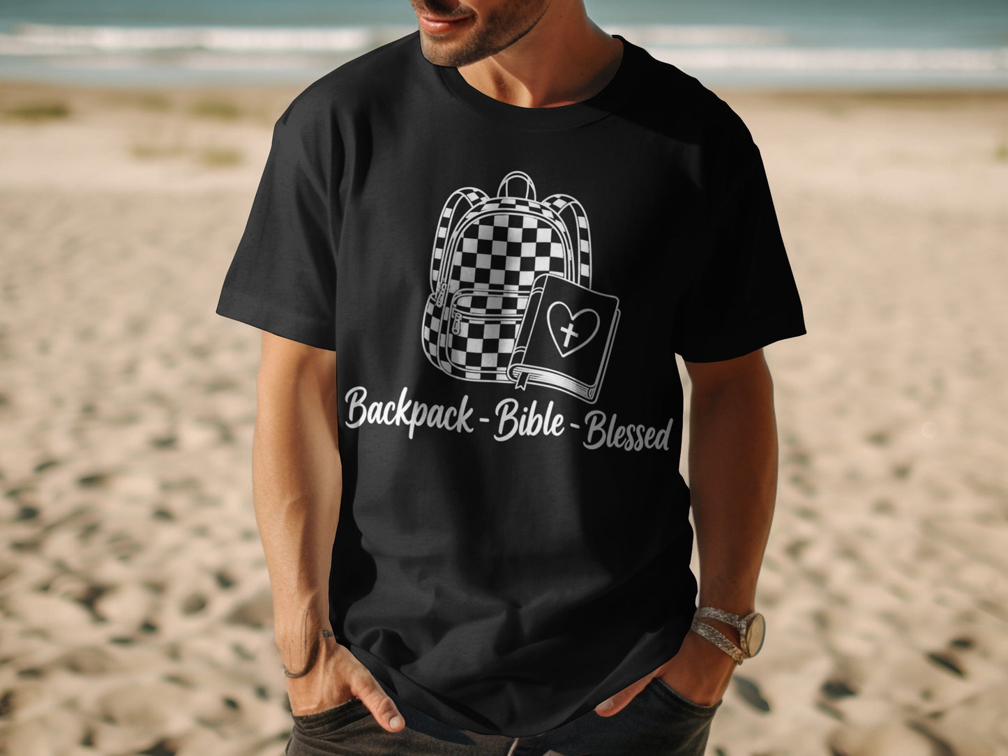 Black t-shirt with white graphic of backpack, bible, and text "Backpack-Bible-Blessed".