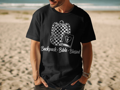 Black t-shirt with white graphic of backpack, bible, and text "Backpack-Bible-Blessed".