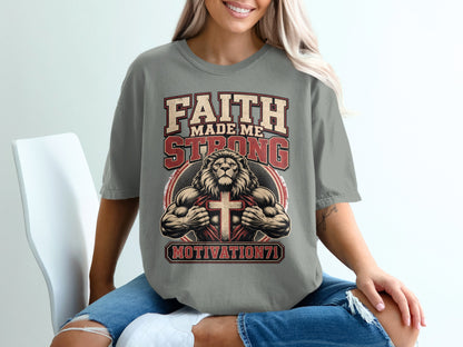 Grey t-shirt with "FAITH MADE ME STRONG" text and a muscular lion revealing a cross.
