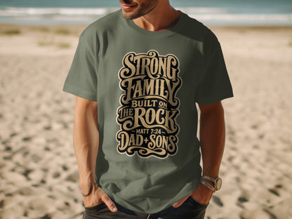 Green t-shirt with text: "Strong Family Built on The Rock - Matt 7:24 - Dad + Sons"