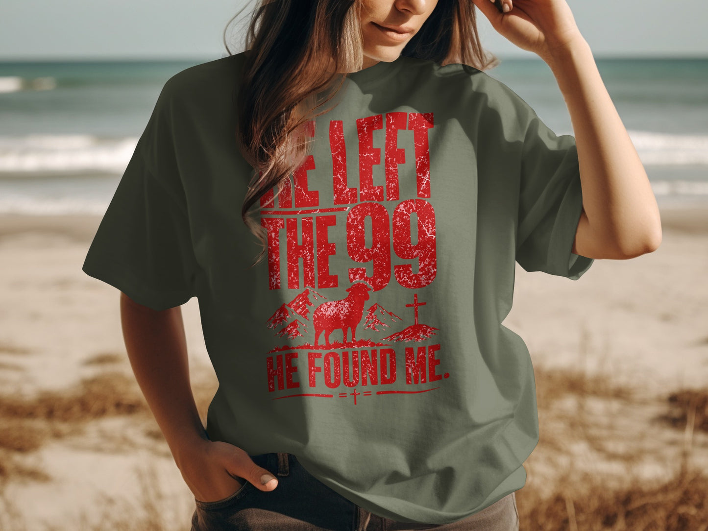 Olive green t-shirt with red distressed text and graphics of sheep and cross.