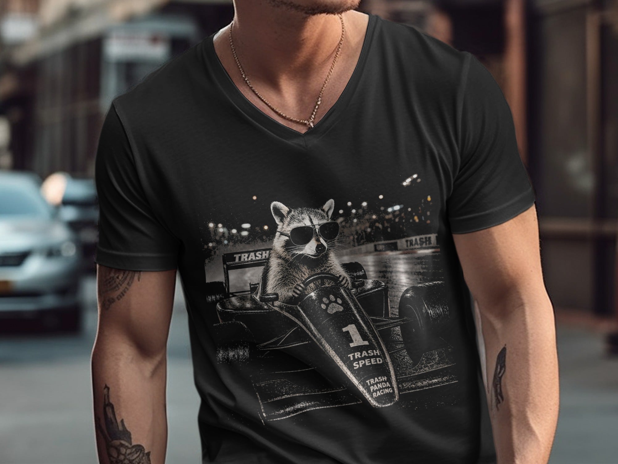 Black t-shirt with graphic of raccoon in race car, "Trash Speed" and "Trash Panda Racing".