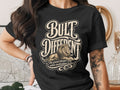 Black t-shirt with lion graphic and text "BULT DIFFERENT" and "The grind doesn't stop".