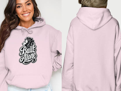 Pink hoodie with a black lion logo and "Built Alone" text.