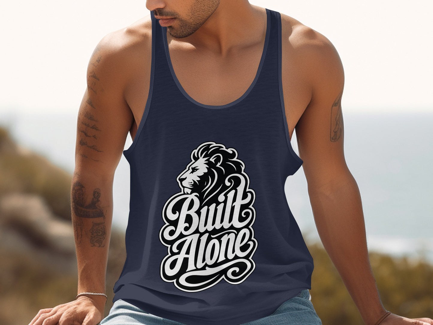 Navy tank top with a black and white lion graphic and the words "Built Alone".